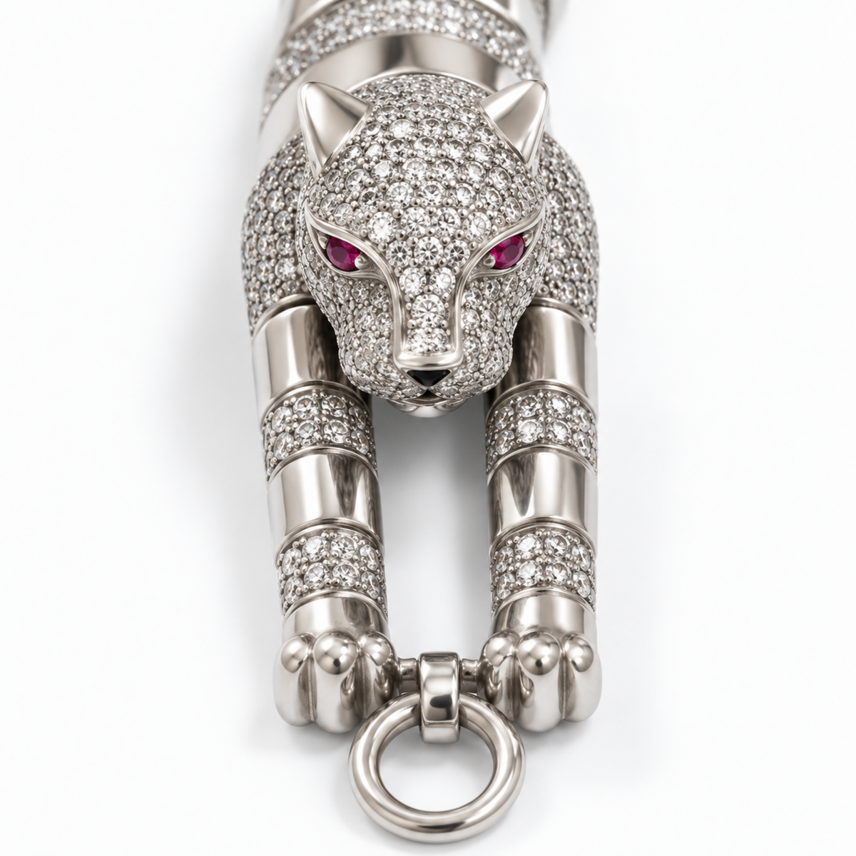 Close-up of the pavé panther head, clear stones, polished finish and pink-red eyes.