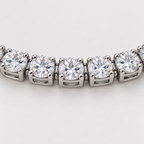 Close-up of clear stones in four-prong silver settings  