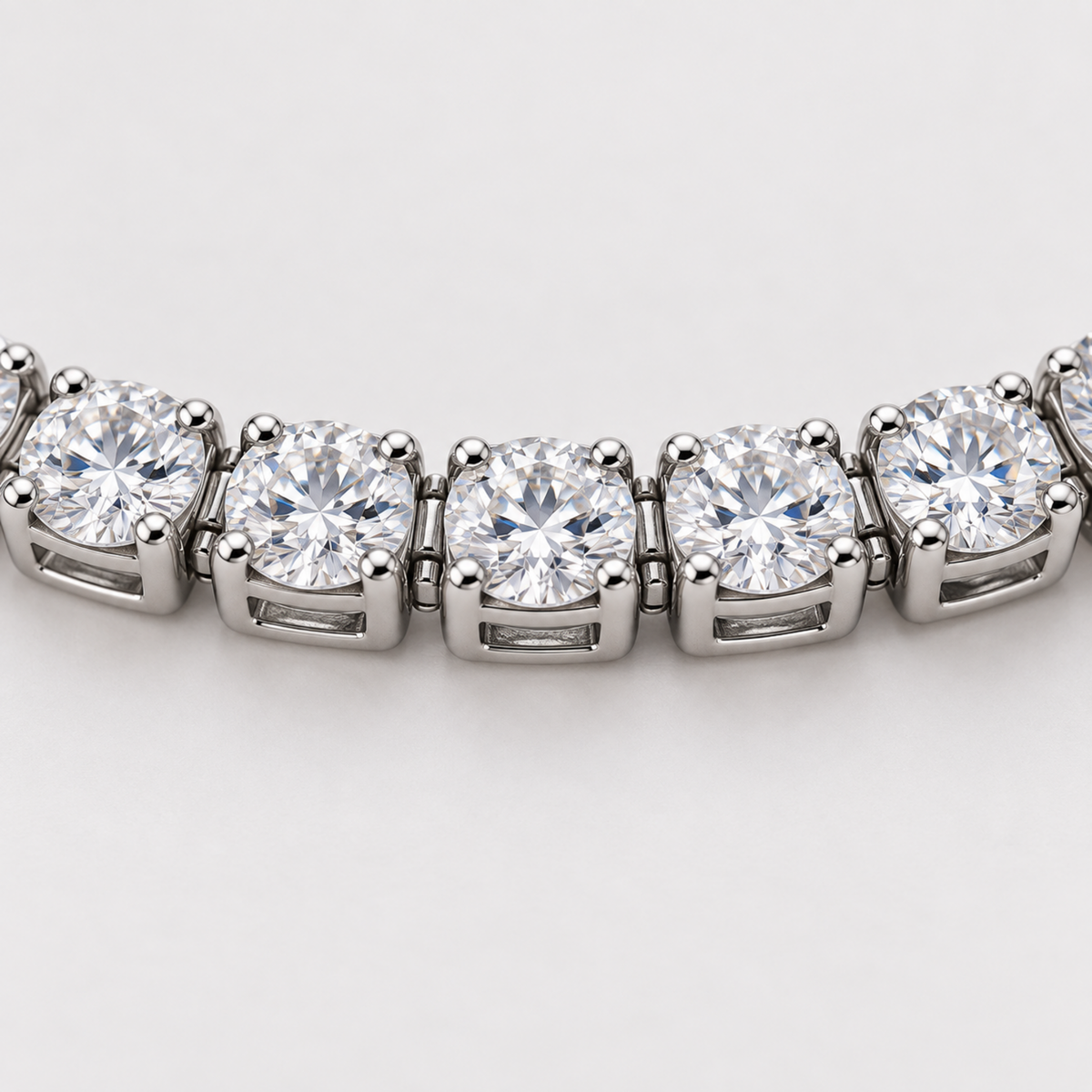 Close-up of clear stones in four-prong silver settings  