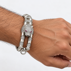 Man wearing a bold silver panther bracelet naturally around his wrist.