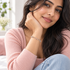 Lifestyle Image: Young woman styling a silver heart link bracelet with a modern Gen Z outfit.