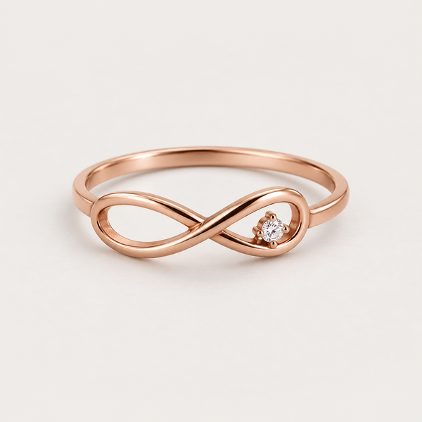 Angled view of Eternal Spark rose gold infinity ring