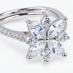 Close-up image: Close-up of marquise-shaped petals and round clear stones on Celeste Bloom silver ring
