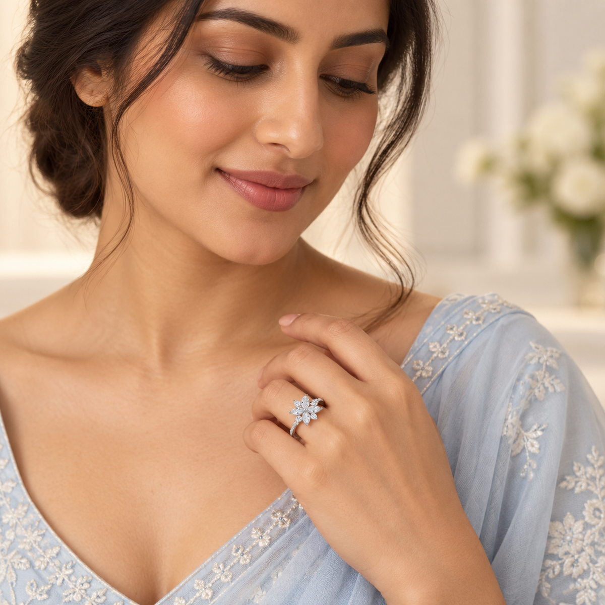 Indian woman styling Celeste Bloom silver floral ring with an elegant soft-blue outfit