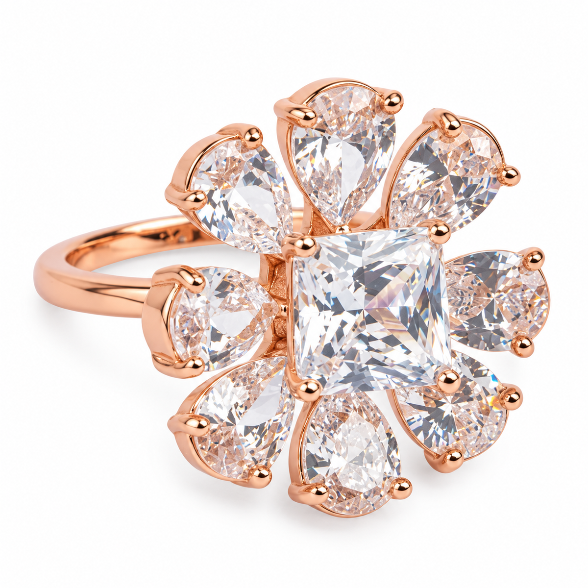 Close-up: Close-up of square centre stone and eight pear-shaped clear stone petals on rose-gold floral ring
