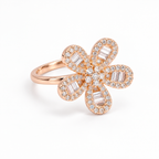 Main image: Rosé Baguette Bloom 925 silver floral ring with baguette and round clear stones on white background
