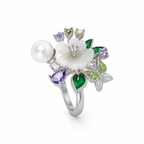 Second angle: Angled view of Enchanted Garden Pearl Ring showing its carved flower, pearl and botanical silver setting