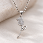 Close-up image: Close-up of round clear stones and polished silver detailing on Everlasting Rose Pendant