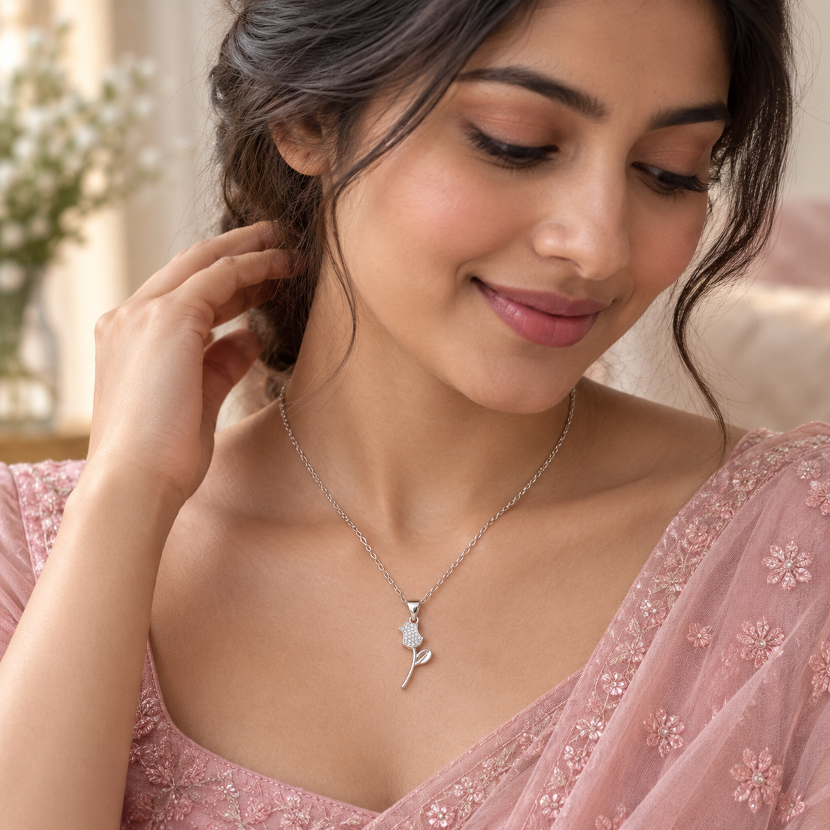 Lifestyle image: Indian woman styling the Everlasting Rose Silver Pendant with an elegant blush-pink outfit