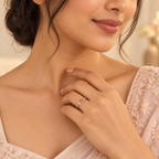 Indian woman styling Amora Swirl Heart ring with an elegant blush outfit