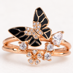 Close-up: Close-up of black enamel butterfly wings, rose-gold outlines and clear stone detailing
