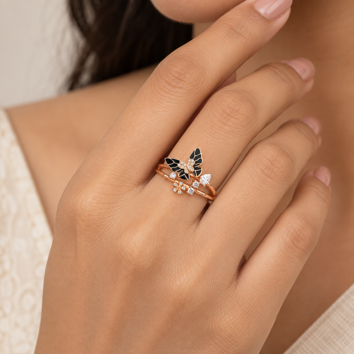Model image: Woman wearing the rose-gold black enamel butterfly ring, showing its actual size and fit