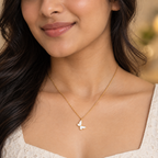 White butterfly pendant necklace worn by an Indian woman  