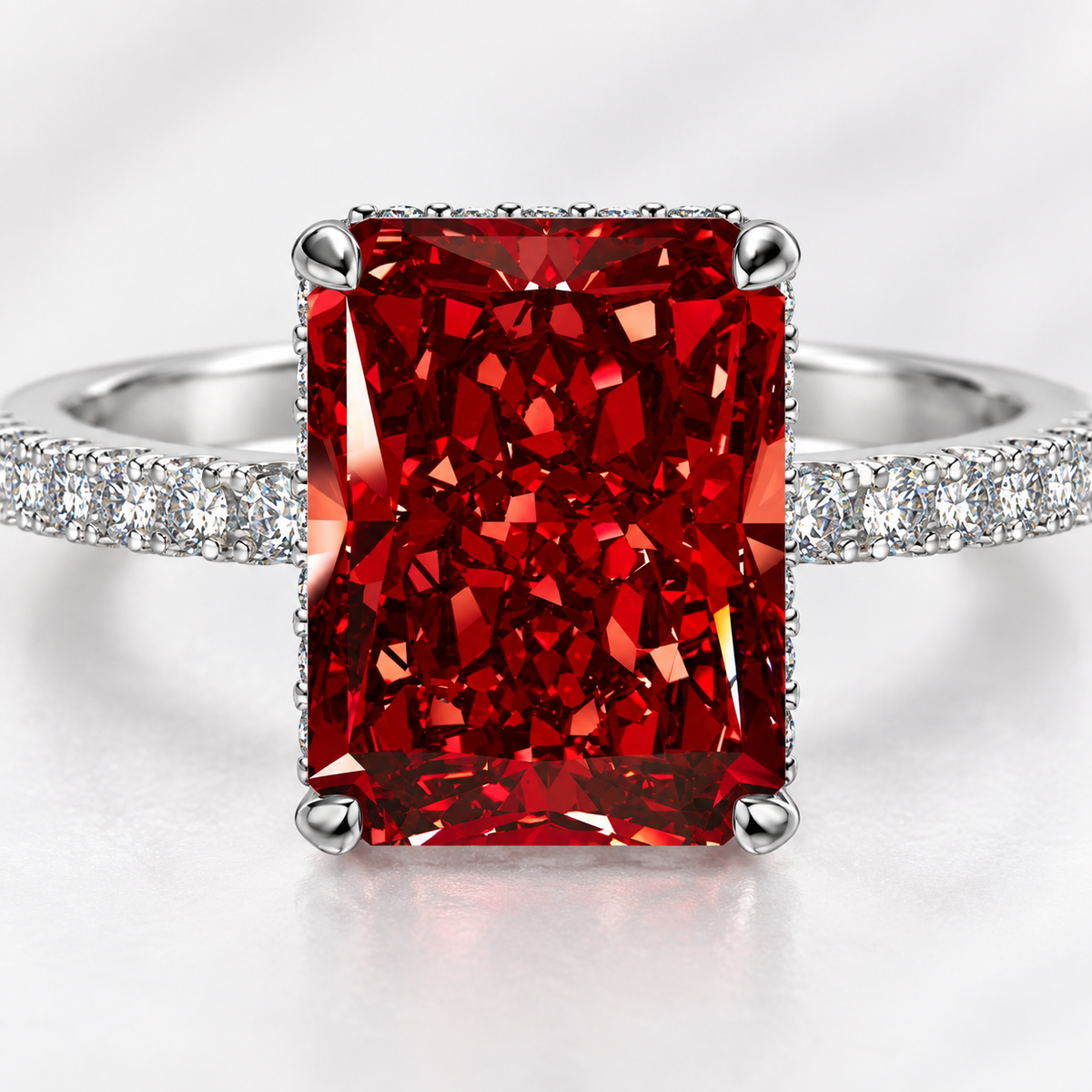 Close-up of the Scarlet Majesty Ring’s red faceted stone and four-prong setting
