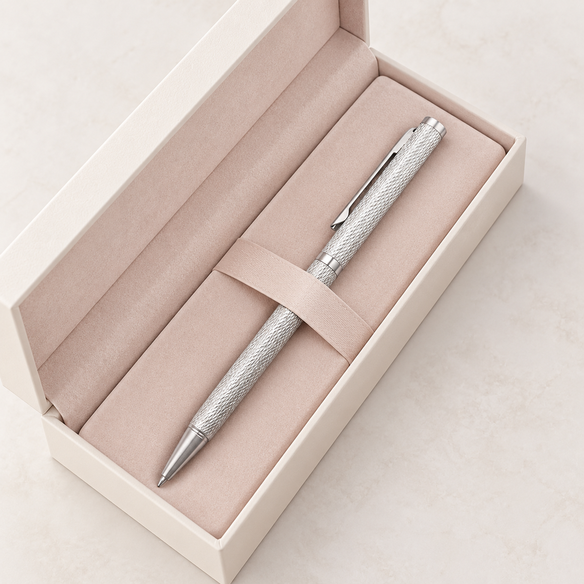 Crosshatch silver ball pen held while writing at a realistic scale