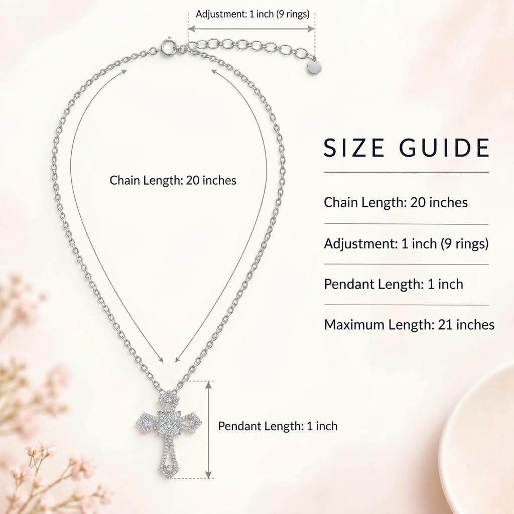 Silver cross pendant necklace with chain length 20 inches and adjustable clasp, shown with size guide text and measurements on a soft pink background.