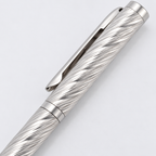 Close-up of the spiral texture and polished clip on a sterling silver pen