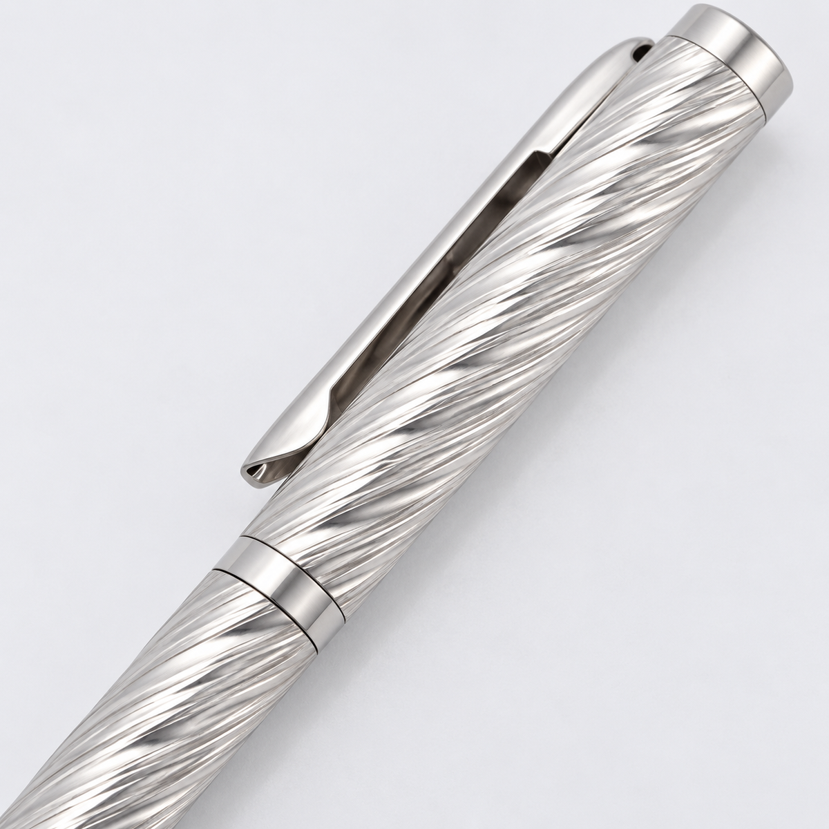 Close-up of the spiral texture and polished clip on a sterling silver pen